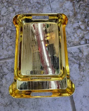 Gold-Toned Metal Serving Trays.