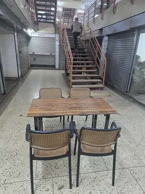 Wooden Table and Plastic Chairs