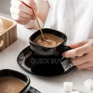 12- Piece Black Opal Glass Coffee Cup and Saucer Set.