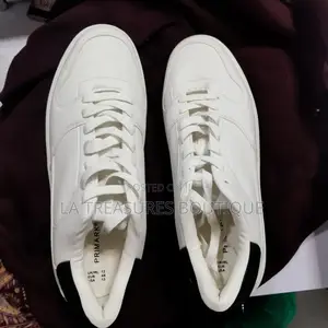 White Low Top Black Heel Sneakers.