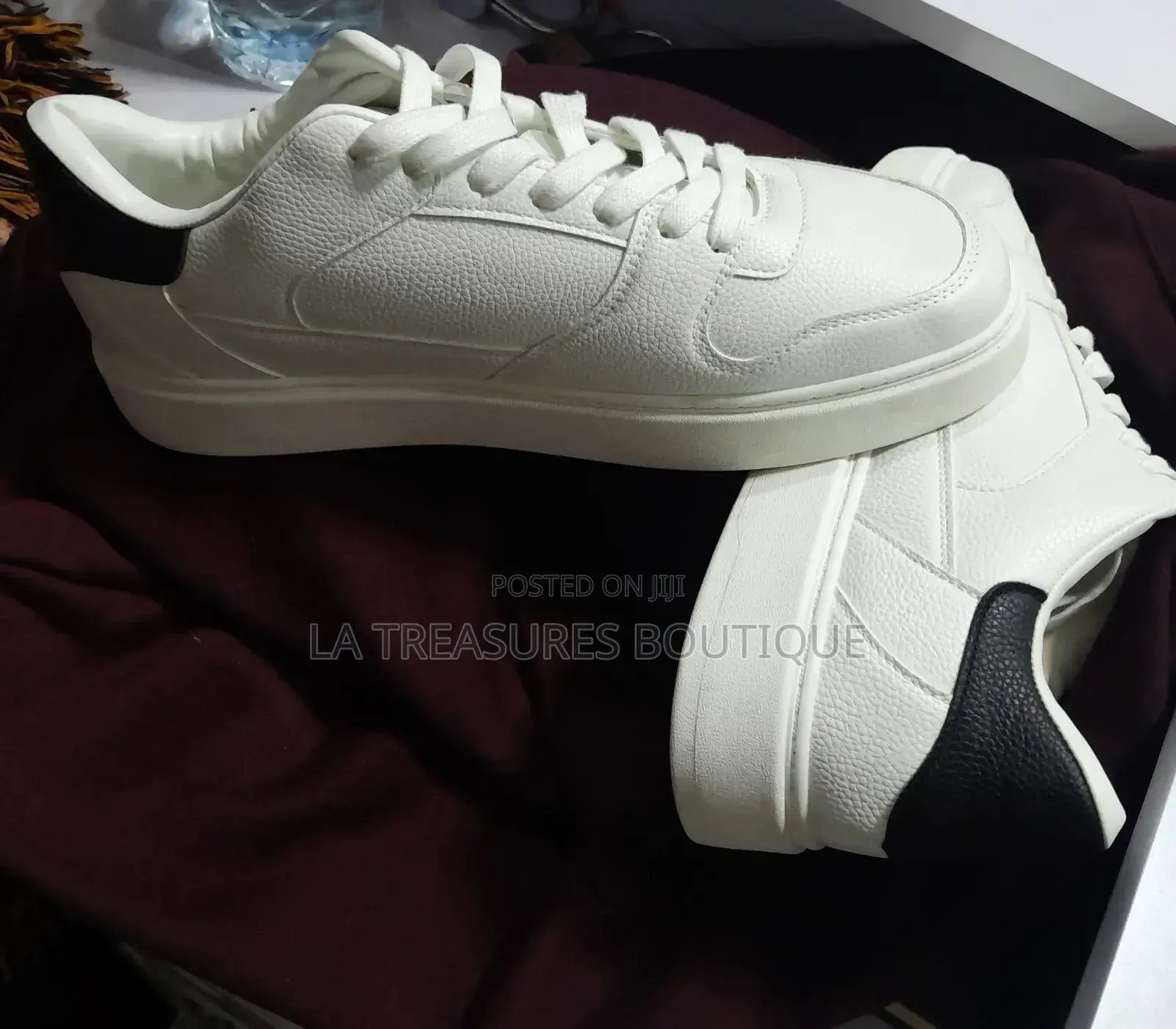 White Low Top Black Heel Sneakers.
