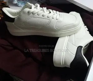 White Low Top Black Heel Sneakers.