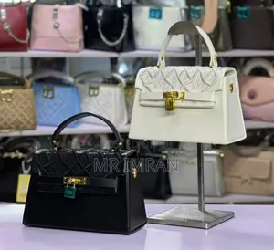 Kelly Bag, Featuring a Structured Shape and a Signature Twist Lock.