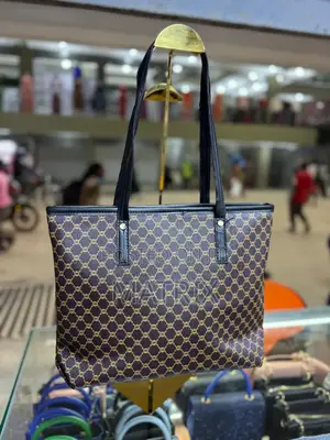 Leather Tote Bag With Durable Shoulder Straps.