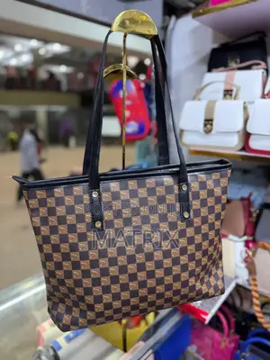 Leather Tote Bag With Durable Shoulder Straps.