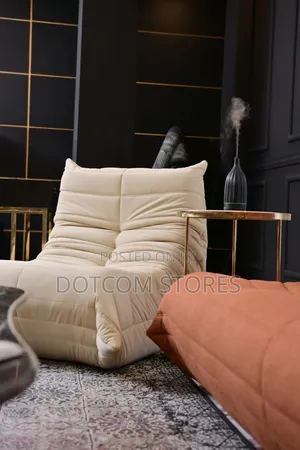 Cream-Colored Caterpillar-Style Bean Bag Chair.
