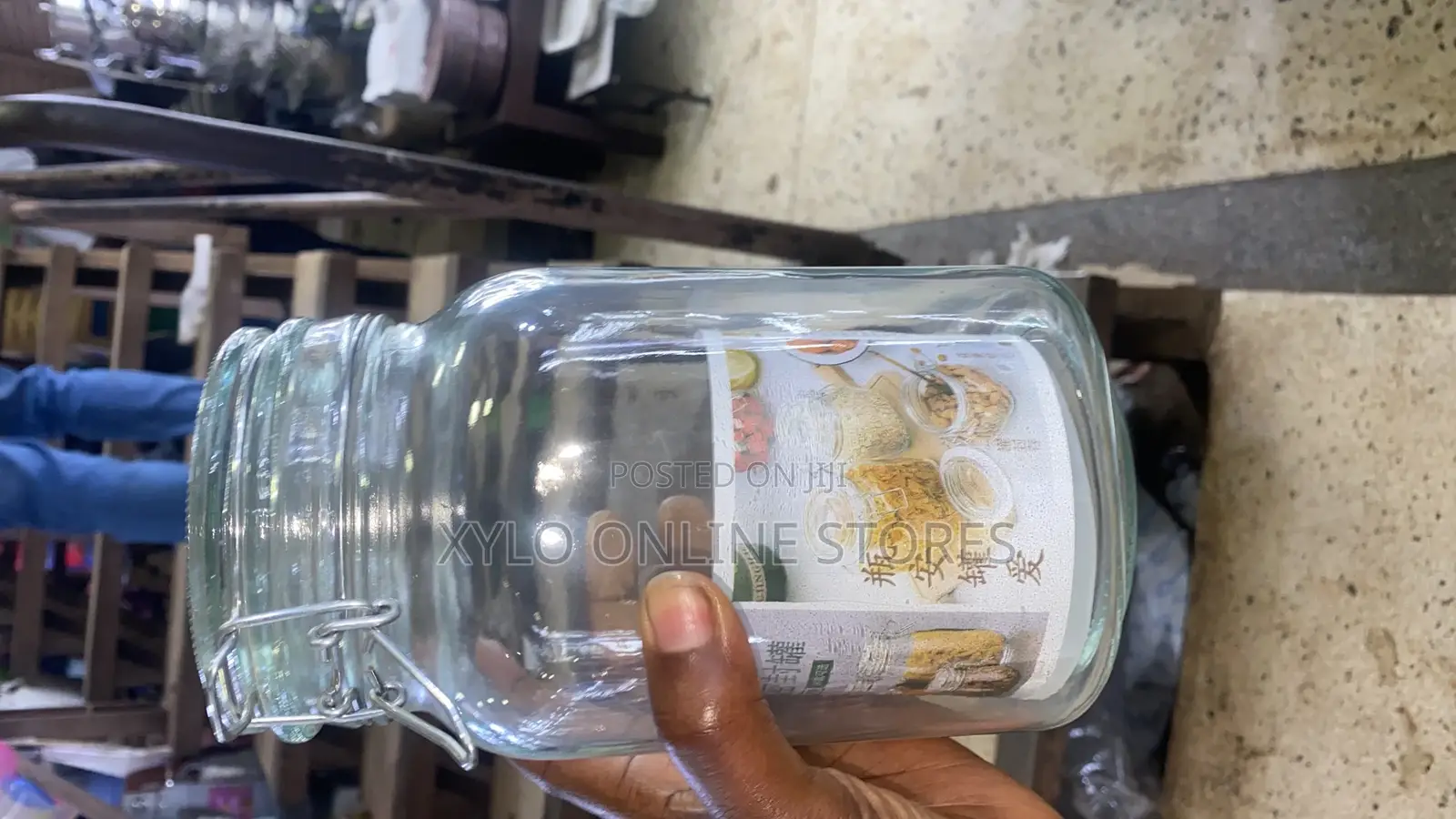 A 3 Liters Clear Glass Storage Jar With a Wire Top Lid