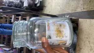 A 3 Liters Clear Glass Storage Jar With a Wire Top Lid