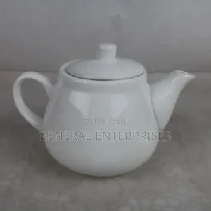 White Ceramic or Porcelain Teapot Commonly Used for Brewing Tea.