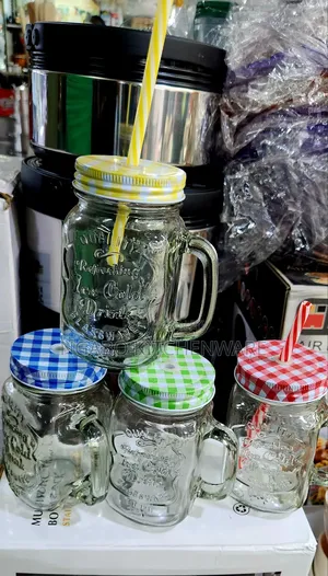 Glass Mason Jar Mugs Equipped With Handles, Lids, and Straws