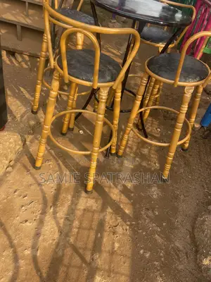 A Set of Bar Stools and Chair