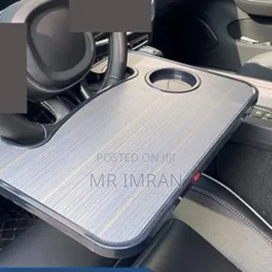 Portable Desk or Table Within a Vehicle Steering Wheel Tray.