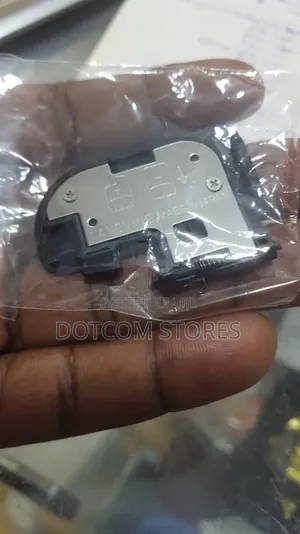 Replacement Battery Door Cover for a Canon DSLR Camera.