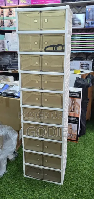 10-Tier Shoe Organizer Cabinet With Brown Semi-Transparent Doors.