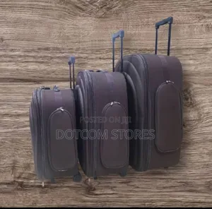 Three Brown Fabric Trolley Suitcases