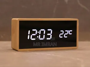 Modern Digital Alarm Clock With a Light Wood-Colored Casing