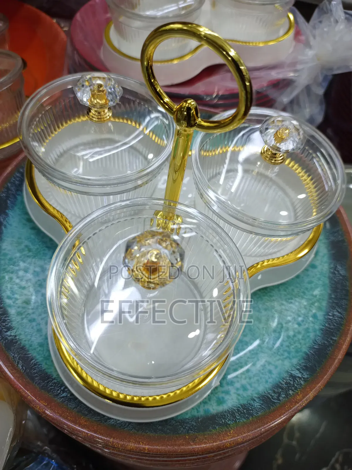 Serving Tray With a Gold Metal Stand and Lid.