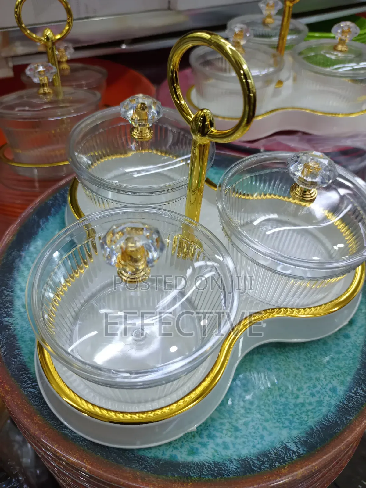 Serving Tray With a Gold Metal Stand and Lid.