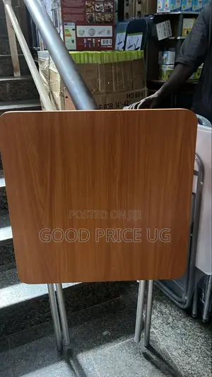 Folding Table With a Wood-Grain Top and a Metallic Stand