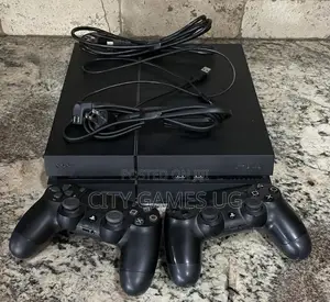 Sony Playstation 4 Black Console With 2 Controllers and 10games
