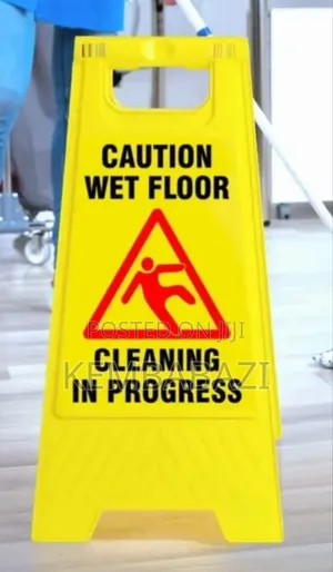 Yellow A-frame "Caution Wet Floor" Warning Sign.