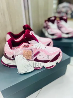 New Balance 9060 Sneakers in Pink and Burgundy