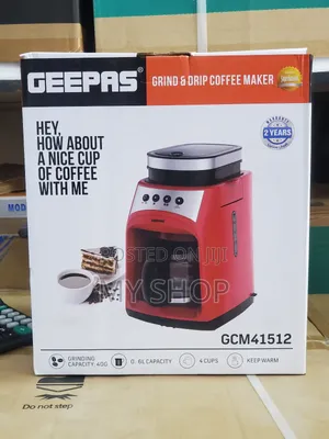 A Coffee Maker With a Coffee Grinder on It