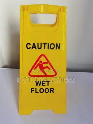 Caution Wet Floor" Safety Sign.