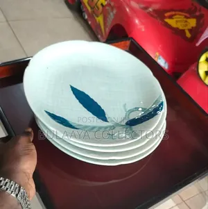 Japanese Ceramic Dinner Plate Features a Blue and White Leaf Pattern.