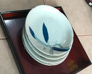 Japanese Ceramic Dinner Plate Features a Blue and White Leaf Pattern.