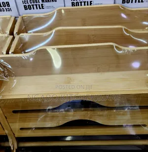 Bamboo Kitchen Foil and Plastic Wrap Dispenser With a Sliding Cutter.