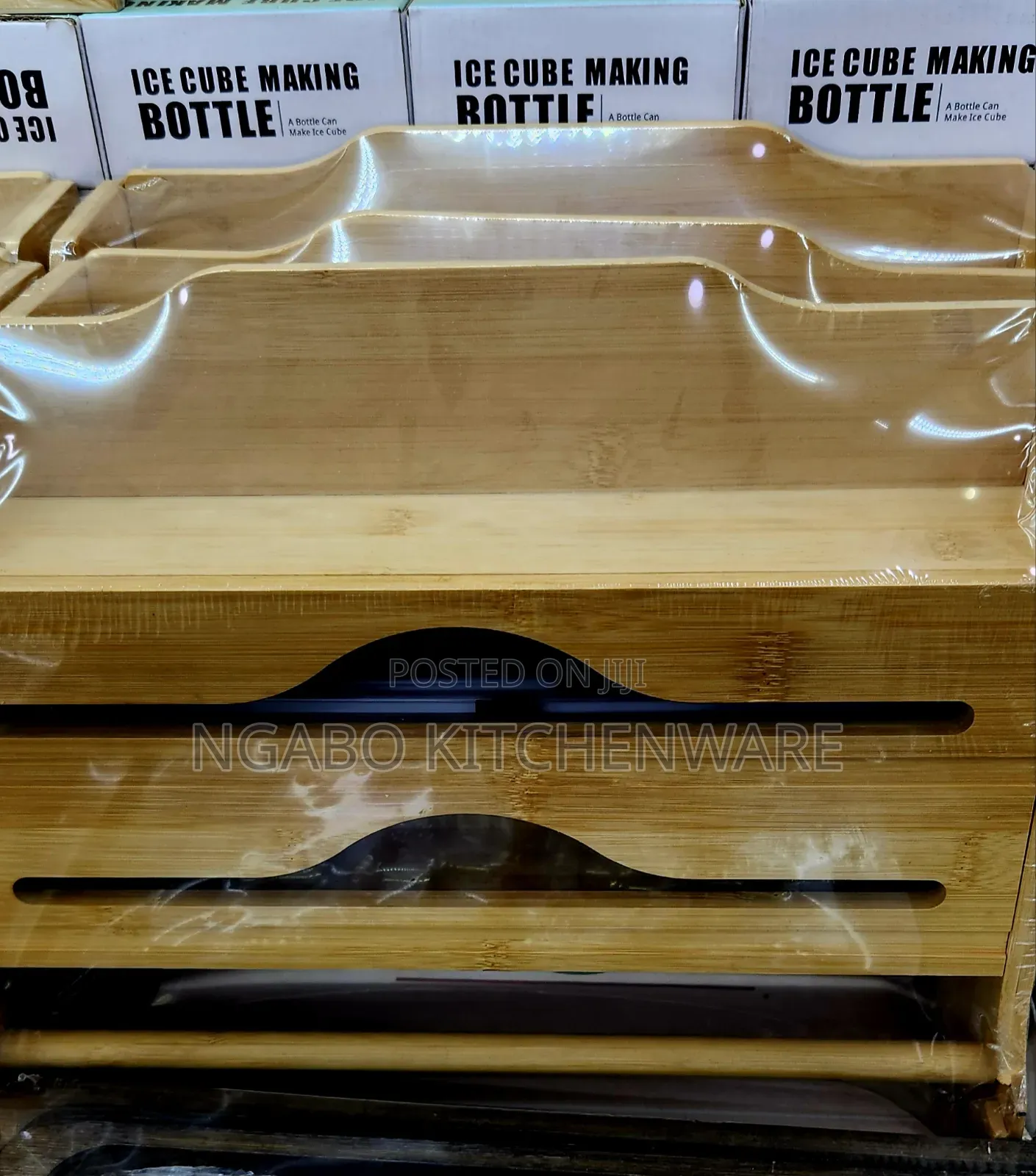 Bamboo Kitchen Foil and Plastic Wrap Dispenser With a Sliding Cutter.