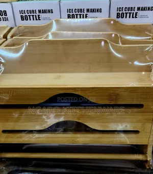 Bamboo Kitchen Foil and Plastic Wrap Dispenser With a Sliding Cutter.
