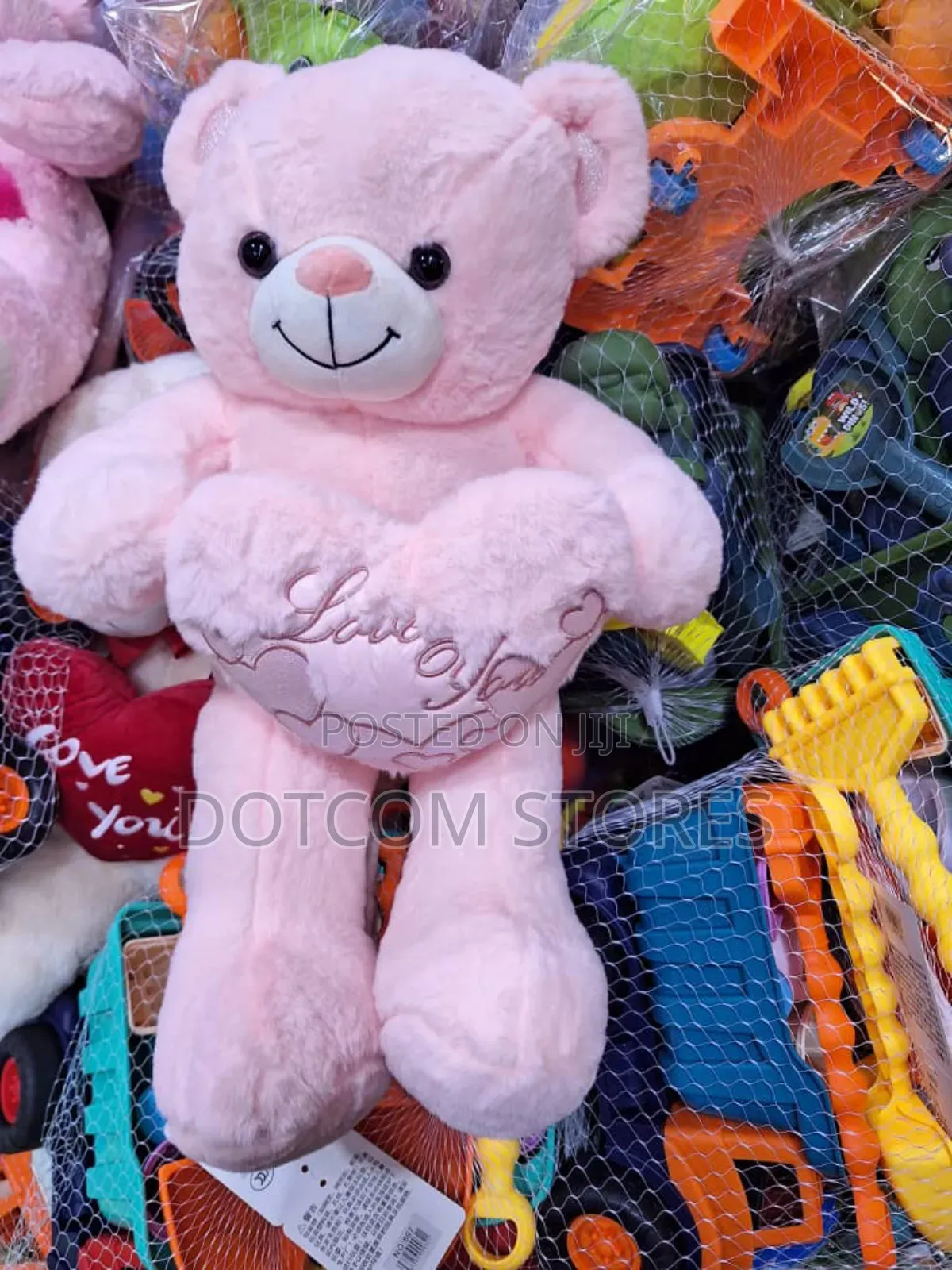 Plush Teddy Bear Holding a Red Heart.