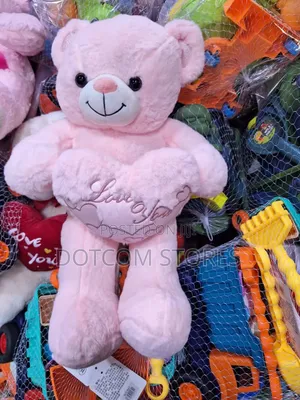 Plush Teddy Bear Holding a Red Heart.