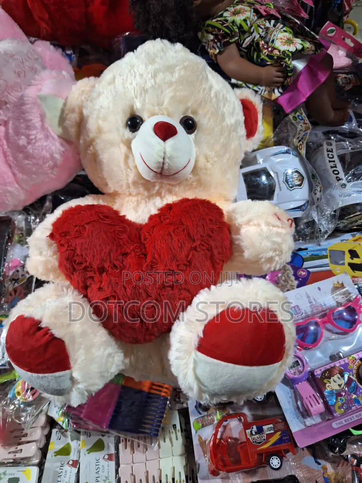 Plush Teddy Bear Holding a Red Heart.