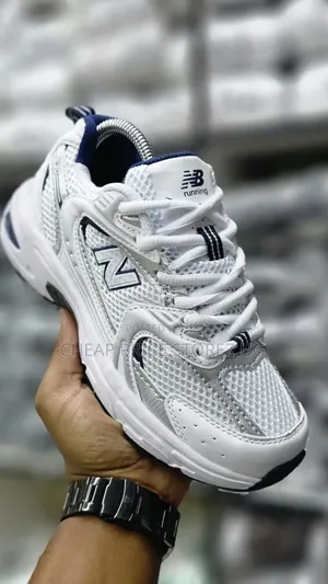 The Product Is a New Balance 530 Sneaker in White and Silver.