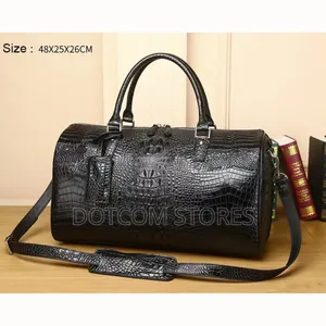 Black Alligator-Embossed (Or Crocodile-Pattern) Duffel Bag.