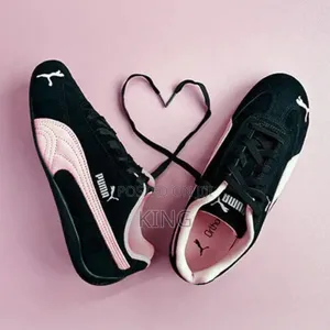 Puma Speedcat Og Sneaker in a Black and Pink Colorway.