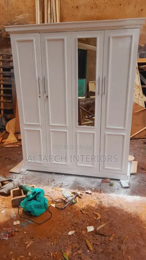 Well Finished Wardrobe in White and a Mirror