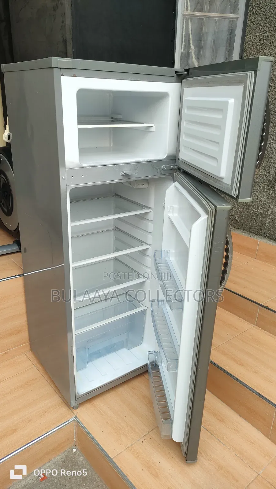 Mika Brand Silver Double-Door Top-Mount Refrigerator.
