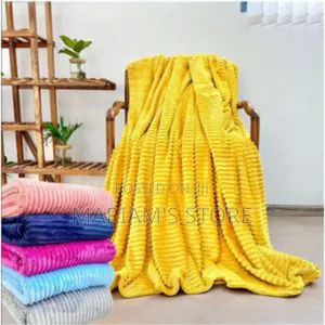 Stack of Soft, Ribbed Plush Fleece Throw Blanket