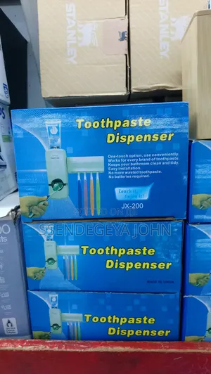 Jx-200 Automatic Toothpaste Dispenser and Toothbrush Holder Set.