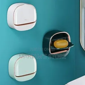 Wall-Mounted Soap Dish With a Lid and Adhesive Backing.