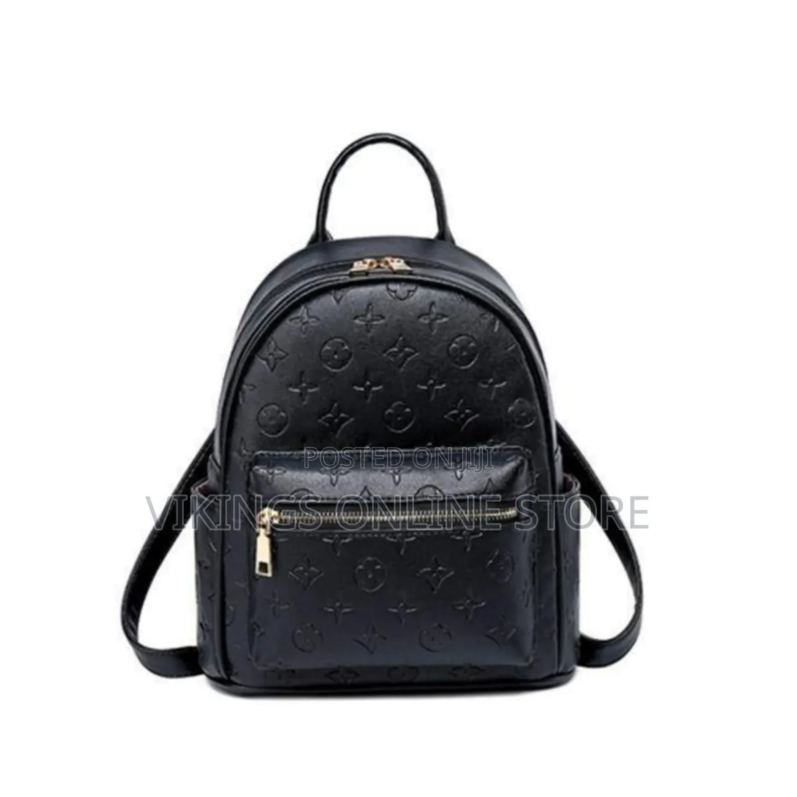 An Embossed Monogram Mini Backpack Bag