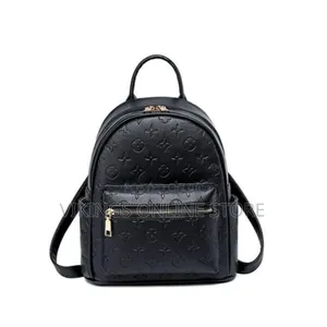An Embossed Monogram Mini Backpack Bag