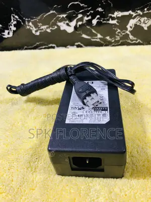 Hp Ac Power Adapter With a Gray 3-Pin Connector.