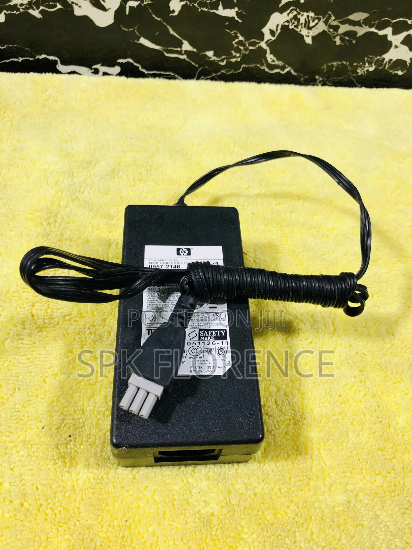 Hp Ac Power Adapter With a Gray 3-Pin Connector.