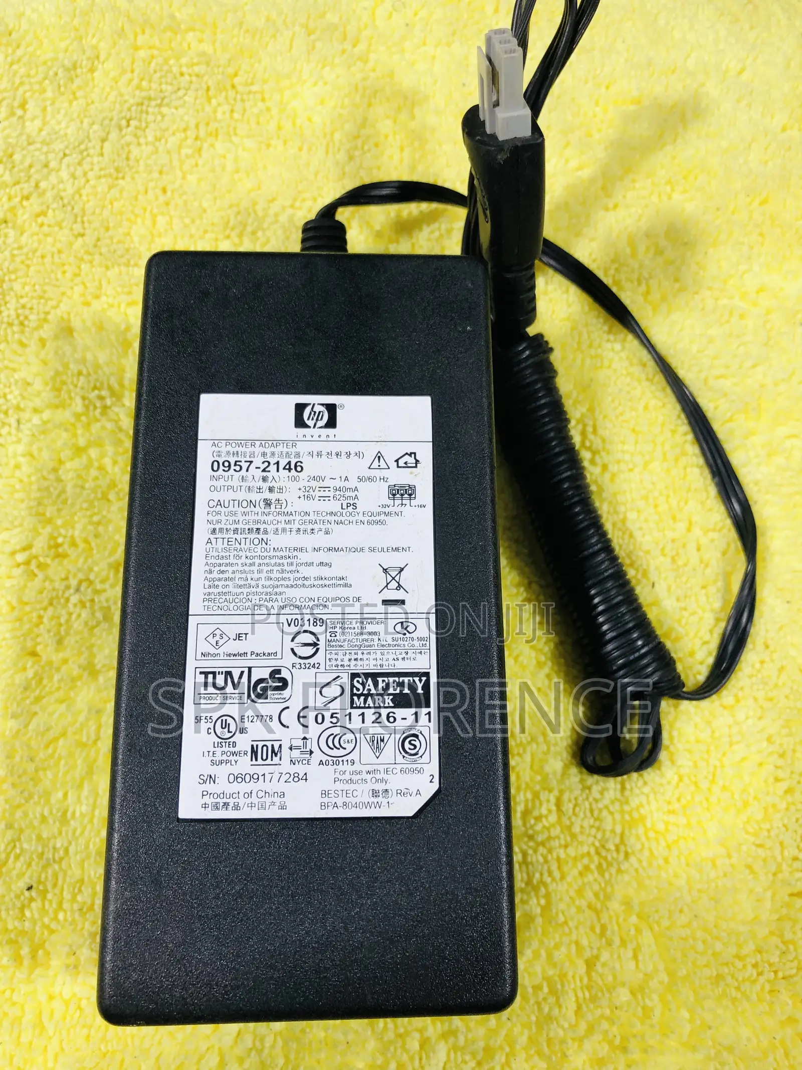 Hp Ac Power Adapter With a Gray 3-Pin Connector.