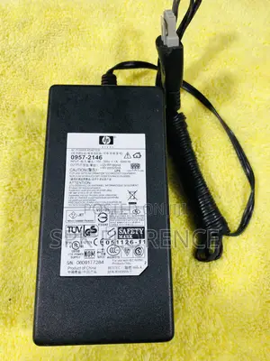 Hp Ac Power Adapter With a Gray 3-Pin Connector.